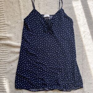 Everly floral spaghetti strap mini dress with cut out tie detail on the front.